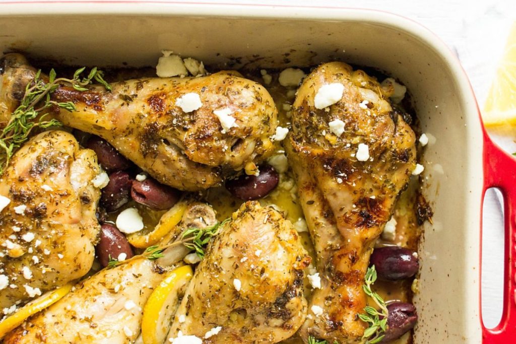 Greek chicken in a baking pan.