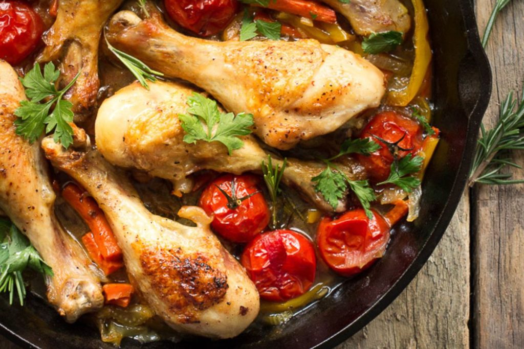 Chicken contadina in a black skillet.