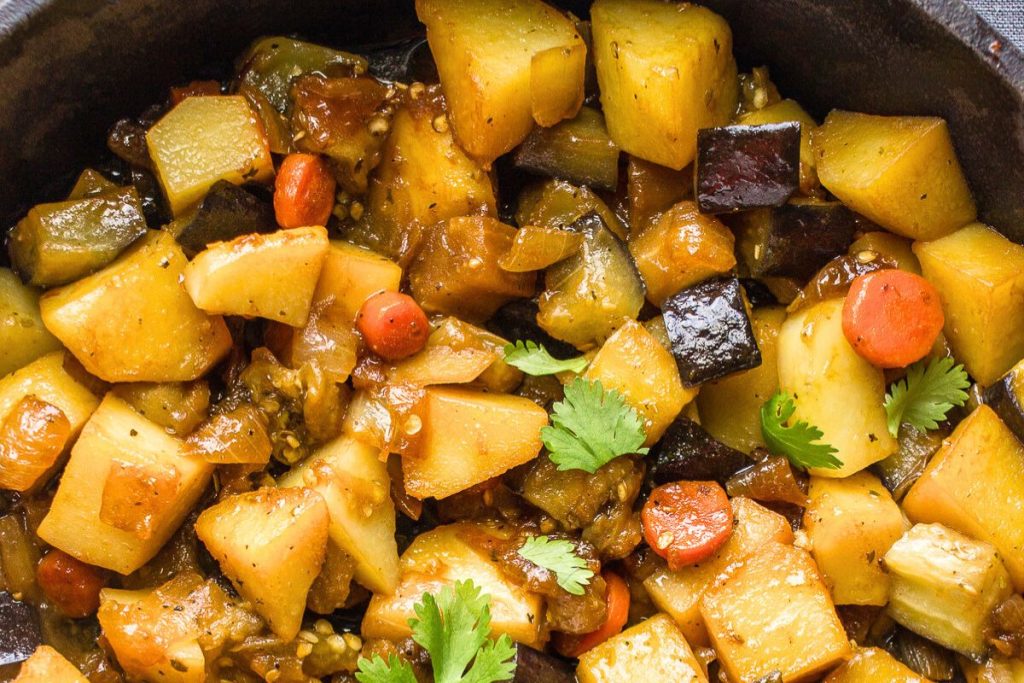 Eggplant stew in a cast iron skillet.