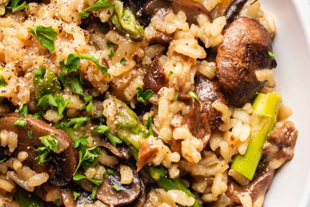 Mushroom asparagus risotto in a bowl.