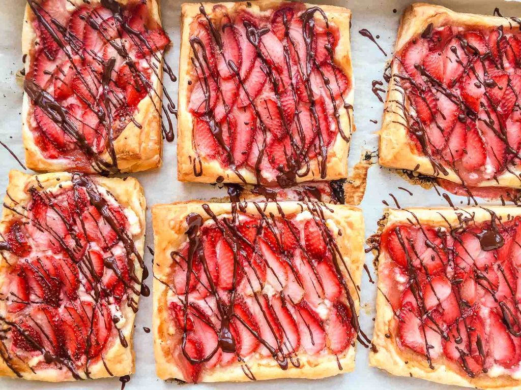 Strawberry tarts on a white background.